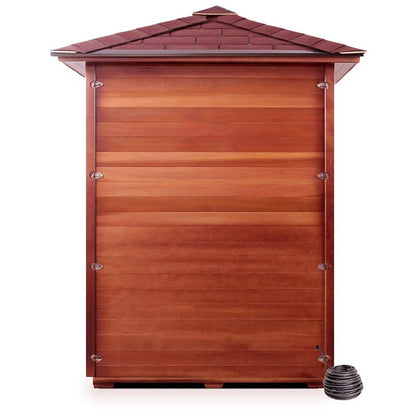 Wooden hot tub enclosure with a red shingle roof and a coiled hose on the side.