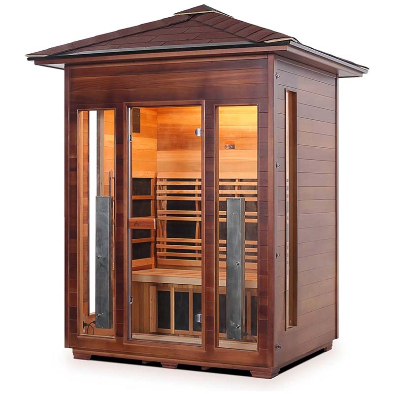 Outdoor infrared sauna with cedar wood panels and glass doors for home relaxation.