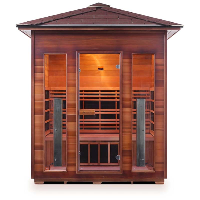 Outdoor infrared sauna with cedar wood panels and glass door.