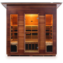 Cedar infrared sauna with glass doors and warm interior lighting.