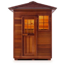 Cedar infrared sauna with glass windows and a wooden door.