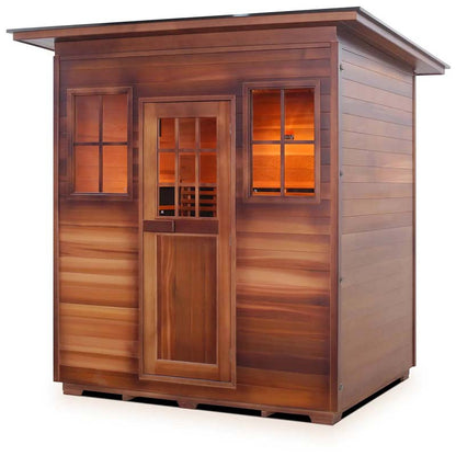 Outdoor cedar sauna with windows and a slanted roof, ideal for home relaxation.