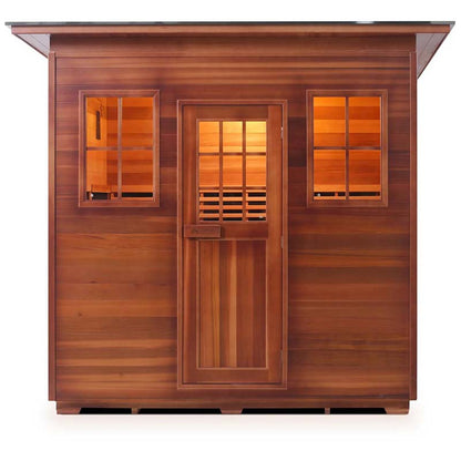 Outdoor cedar sauna with glass windows and door, warm interior lighting.