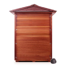 A wooden garden shed with a sloped roof and horizontal wooden slats, accompanied by a small black garden hose on the ground.