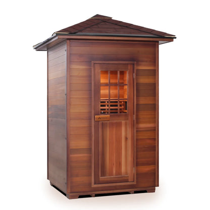 Wooden sauna with a peaked roof and a windowed door, showcasing a natural cedar finish.
