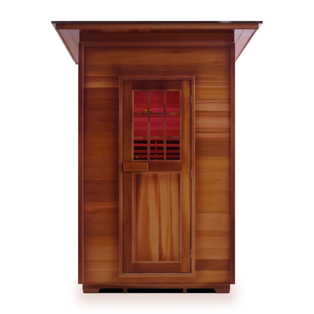 Front view of a wooden sauna with a door and small window, showcasing a rich, natural wood finish.