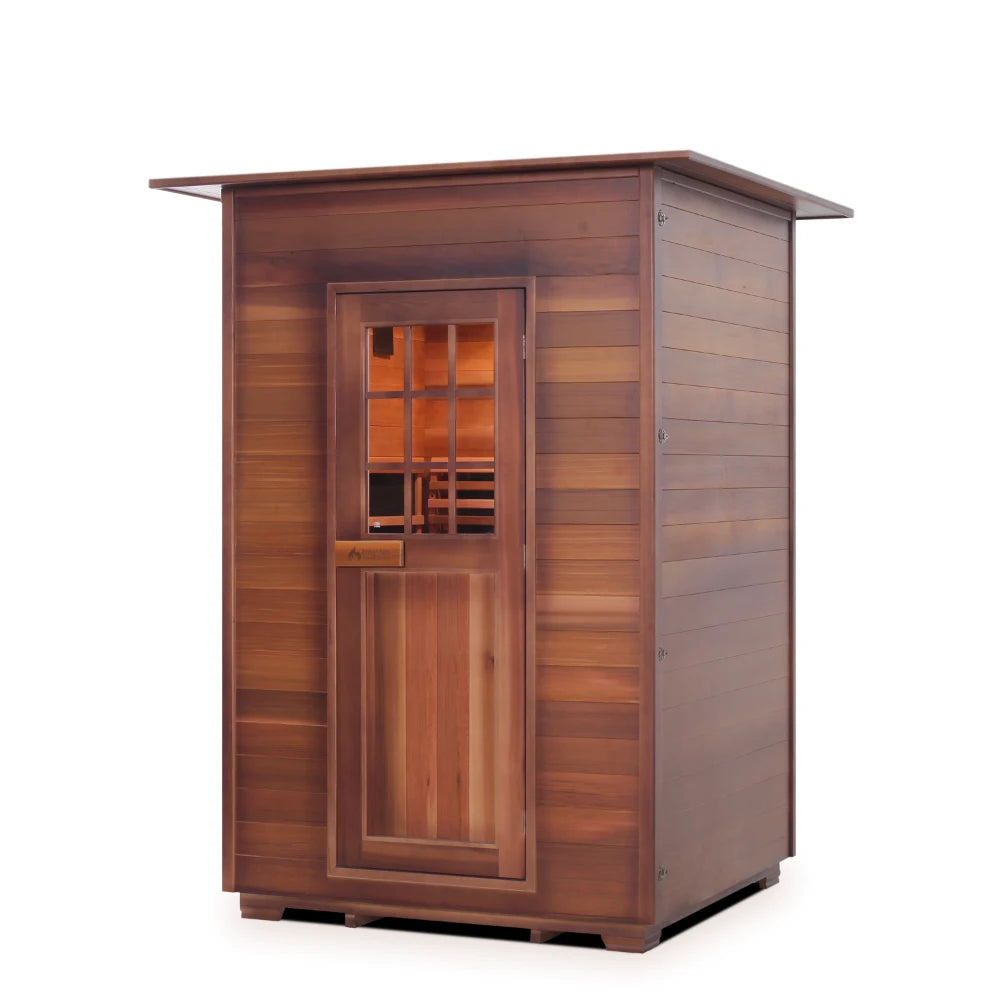 A wooden sauna with a door and window, showcasing a natural wood finish and modern design, set against a neutral background.