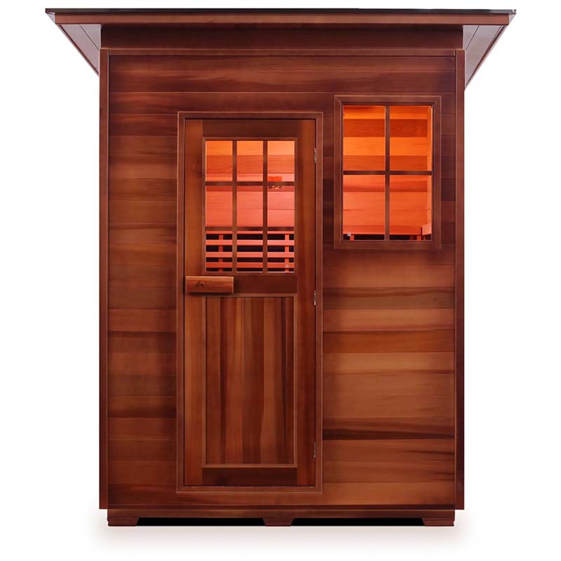 Cedar infrared sauna cabin with window and door, warm interior glow.