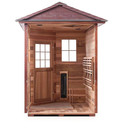 Cedar infrared sauna with glass door and heater inside, featuring a wooden interior and shingle roof.