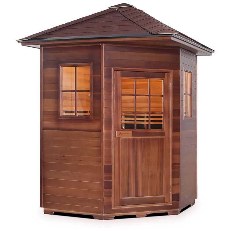 Wooden outdoor sauna with windows and a shingled roof.