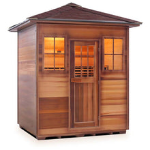 Outdoor cedar sauna with warm interior lighting and shingled roof.
