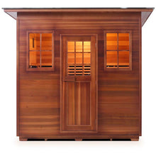 Cedar outdoor sauna with glass windows and door, warm lighting inside.