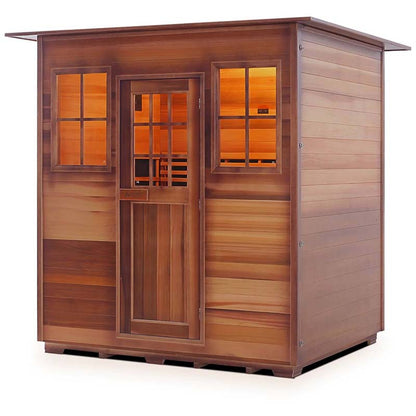 Cedar sauna cabin with warm interior lighting and glass windows.