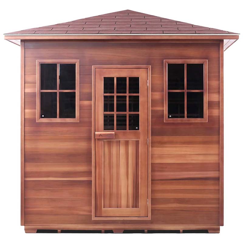 Cedarwood outdoor sauna with glass door and windows, featuring a slanted shingle roof.