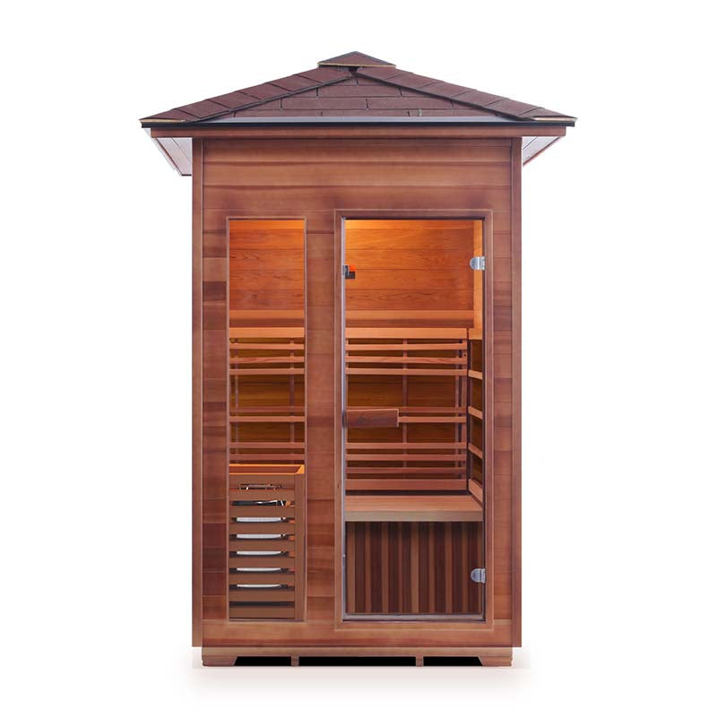 Outdoor cedar sauna with glass door and wooden benches.