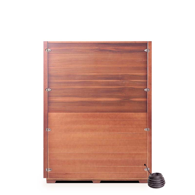 Wooden hot tub with copper finish and attached coil heater for outdoor relaxation.