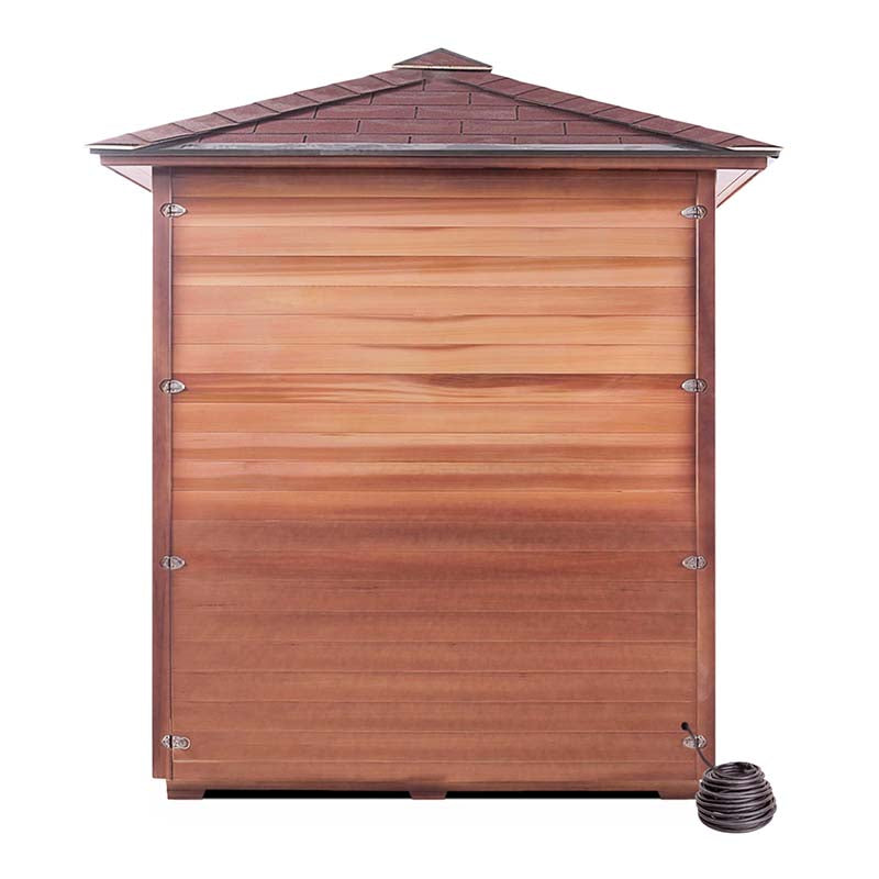 Brown wooden shed with a shingled roof and a small wasp nest at the bottom right corner.