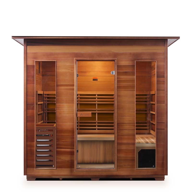 Cedar infrared sauna cabin with glass door and wooden bench for home relaxation.