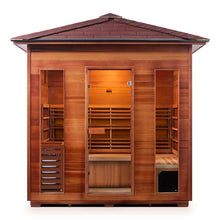 Outdoor cedar infrared sauna with glass door and spacious interior.