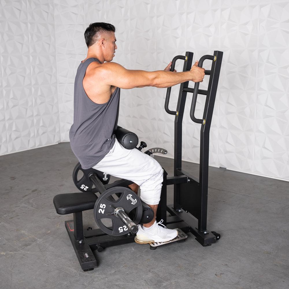 Man using a back extension machine with weights.