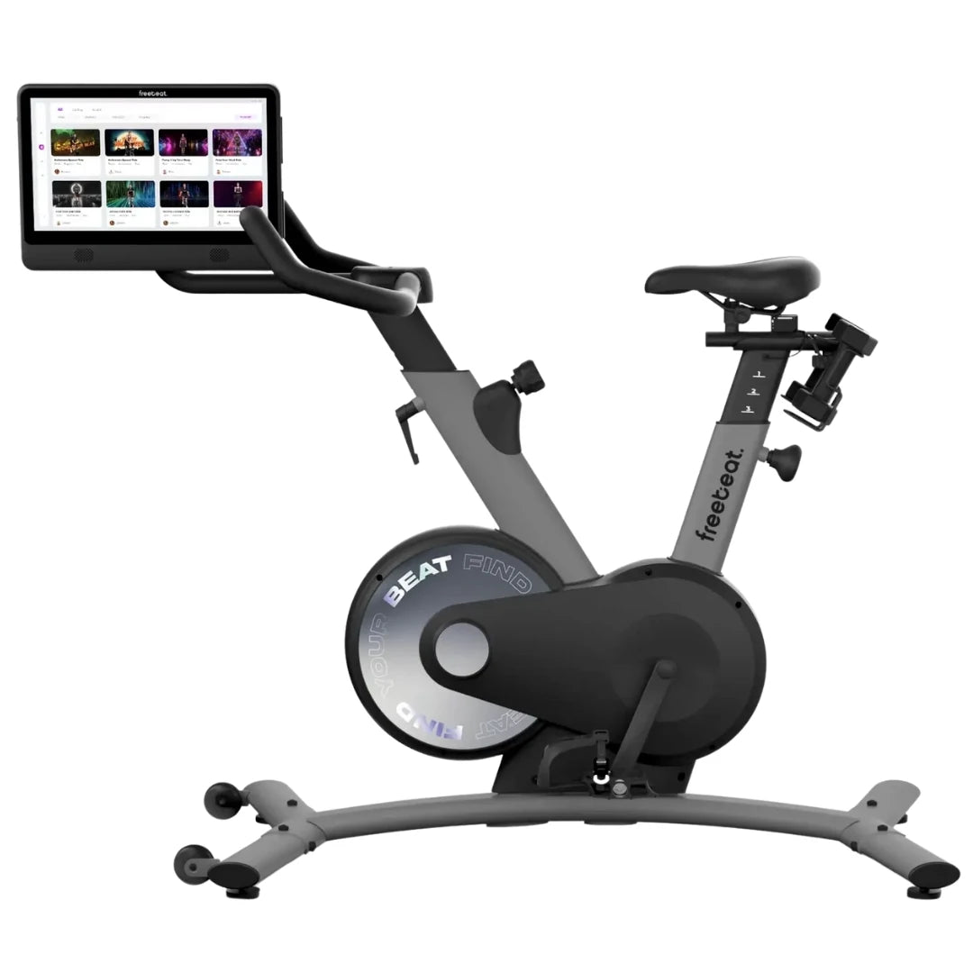 Freebeat Boom Stationary Exercise Bike with a digital display screen showing workout options.