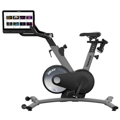 Freebeat Boom Stationary Exercise Bike with a digital display screen showing workout options.