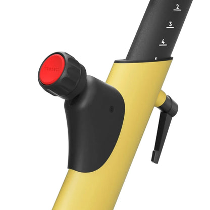 Close-up of the tension adjustment knob on the Freebeat Boom Stationary Exercise Bike, featuring a red dial and a yellow frame.
