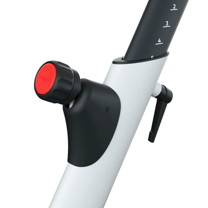 Close-up of the resistance knob and adjustment lever on the Freebeat Boom Stationary Exercise Bike.