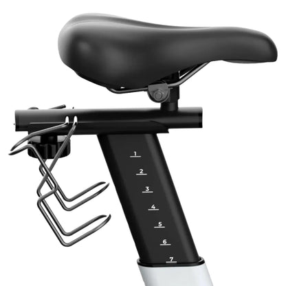Close-up view of the seat and adjustable height mechanism of the Freebeat Boom Stationary Exercise Bike, featuring a numbered scale for height adjustment and a water bottle holder.