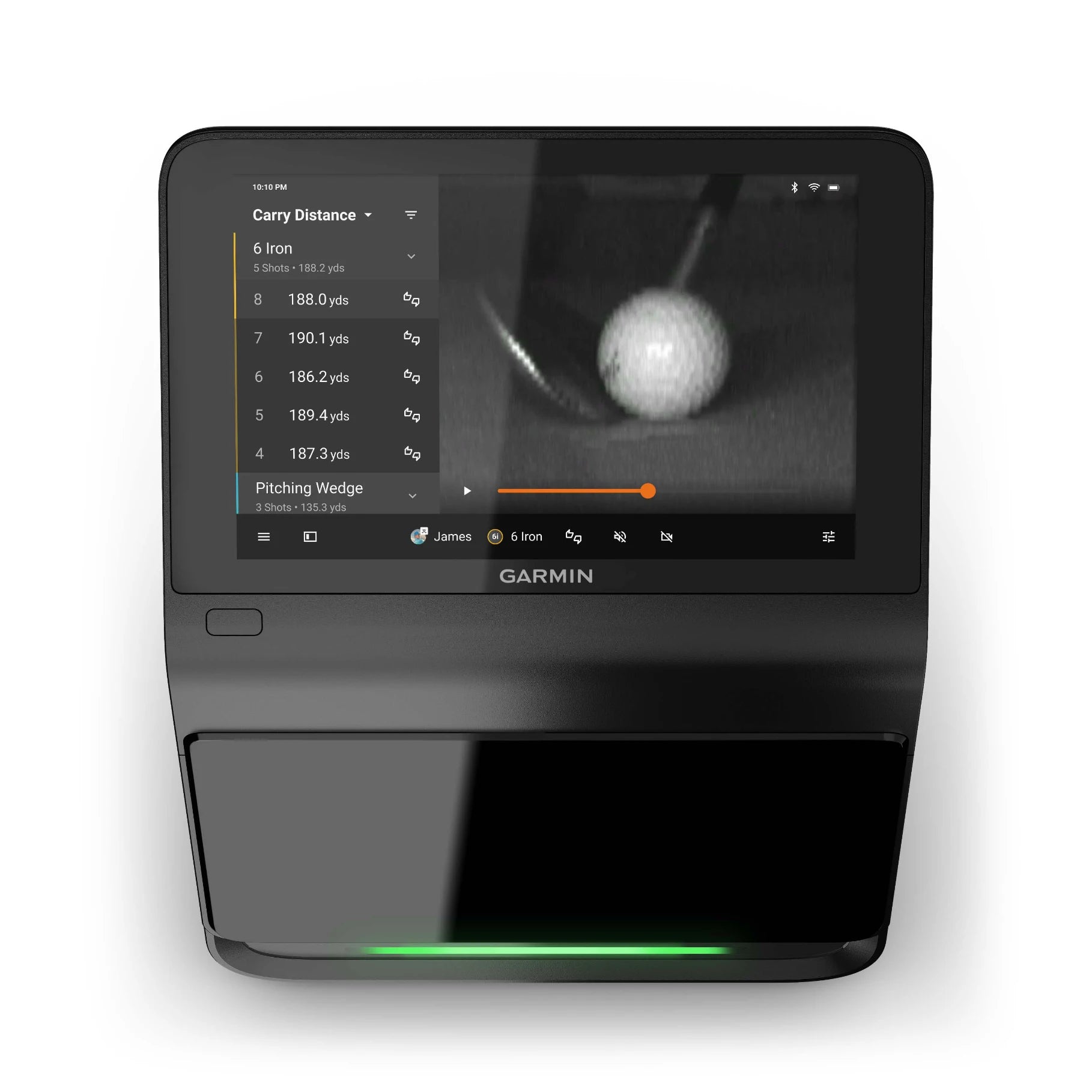Garmin Approach R50 Premium Golf Launch Monitor & Simulator displaying data on carry distance and shot statistics, with a close-up view of a golf ball on the screen.