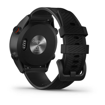 Back view of the Garmin Approach S12 golf watch showing the charging port and textured black silicone strap.
