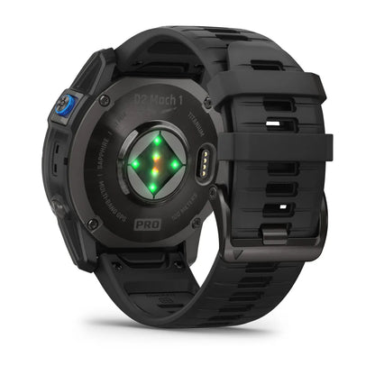 Back view of the Garmin D2 Mach 1 Pro smartwatch, showcasing its titanium case, black silicone strap, and heart rate sensors with green and orange lights.