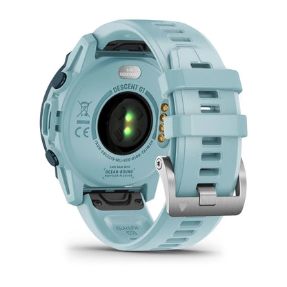 Garmin Descent G1 Solar - Ocean Edition, showing the back view of the smartwatch with a light blue strap and sensor.
