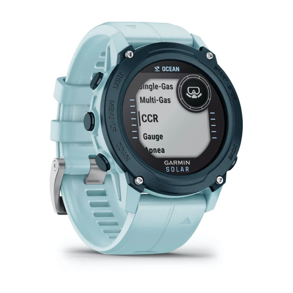 Garmin Descent G1 Solar - Ocean Edition smartwatch with a light blue strap displaying various diving modes on the screen.