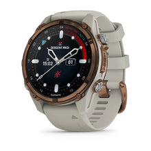 Garmin Descent Mk3i smartwatch with a bronze bezel and a light gray strap, displaying the time and various diving metrics on its black screen.