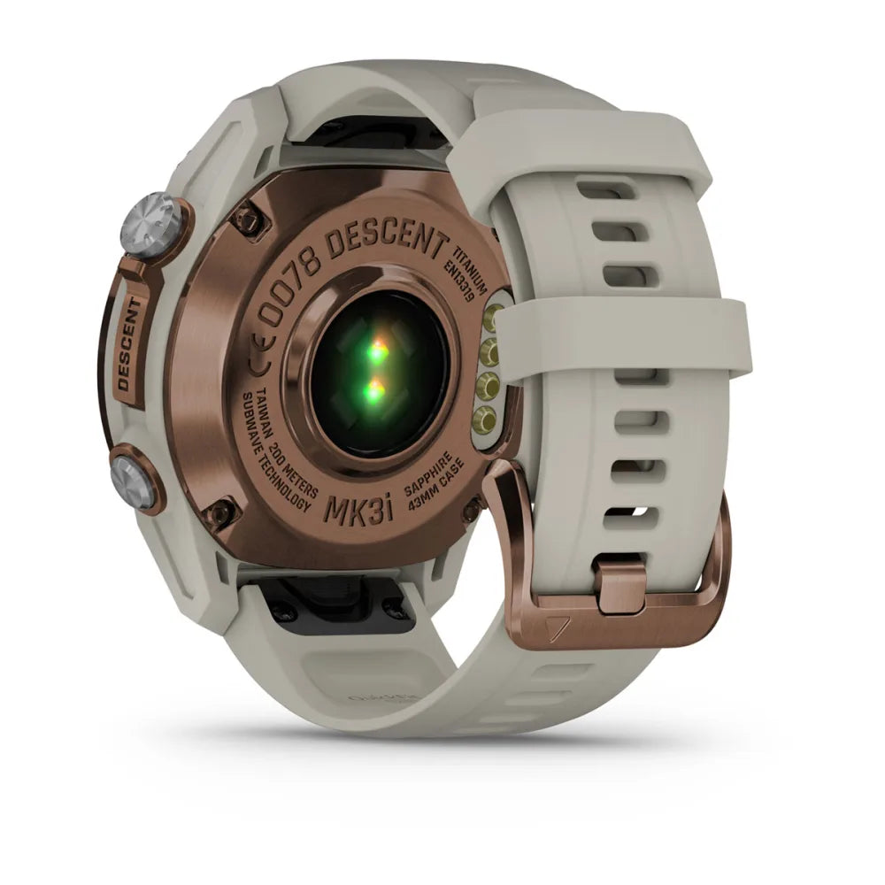Back view of the Garmin Descent Mk3i smartwatch showcasing its titanium case, sapphire lens, and green sensor light.