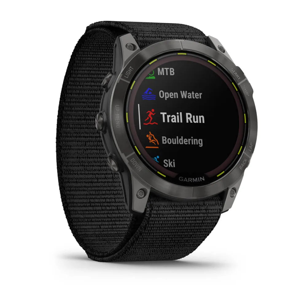 Garmin Enduro 2 smartwatch displaying various activity options including MTB, Open Water, Trail Run, Bouldering, and Ski on its screen.