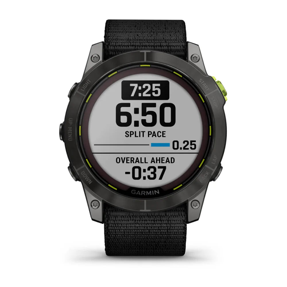 Garmin Enduro 2 smartwatch displaying split pace, overall ahead time, and current time on its screen.