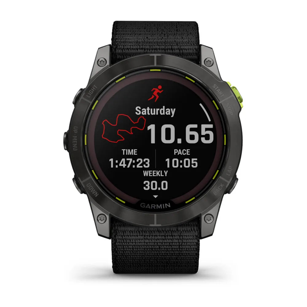 Garmin Enduro 2 smartwatch displaying running statistics including distance, time, pace, and weekly summary on a black background with a textured strap.