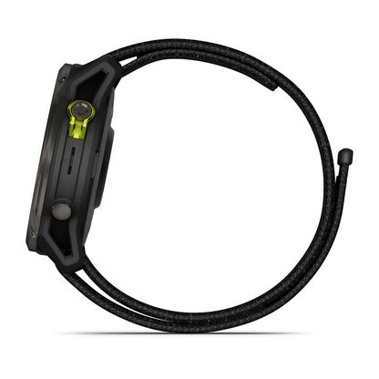 Garmin Enduro 3 smartwatch viewed from the side, featuring a sleek design with a black and green color scheme.