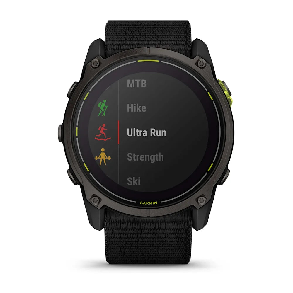 Garmin Enduro 3 smartwatch displaying activity options including MTB, Hike, Ultra Run, Strength, and Ski on a digital screen.