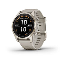 Garmin Fenix 7S Pro Sapphire Solar Edition smartwatch showing a digital watch face with various metrics and a light-colored strap.