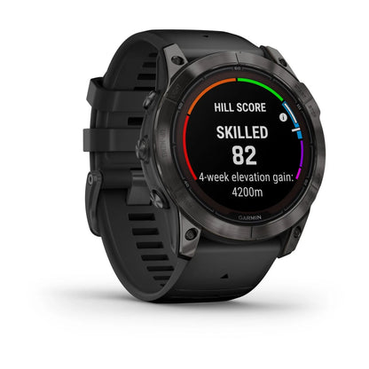 Garmin Fenix 7X Pro Sapphire Solar Edition smartwatch displaying hill score, skilled level, and 4-week elevation gain statistics.