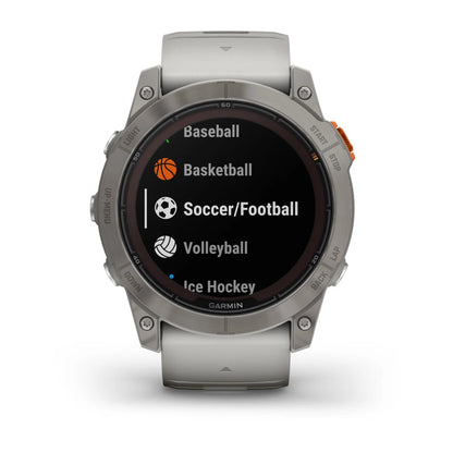 Garmin Fenix 7X Pro Sapphire Solar Edition smartwatch displaying options for various sports including Baseball, Basketball, Soccer/Football, Volleyball, and Ice Hockey.