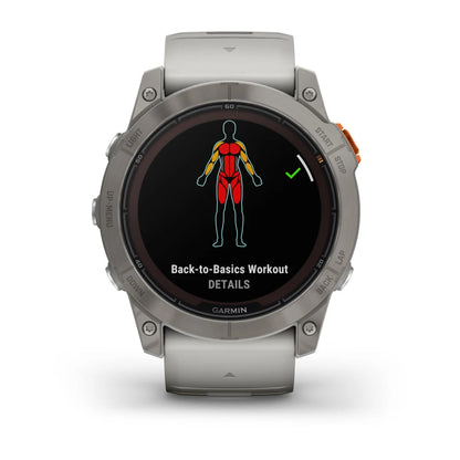Garmin Fenix 7X Pro Sapphire Solar Edition smartwatch displaying a 'Back-to-Basics Workout' screen with a graphic of a human body highlighting muscle groups.