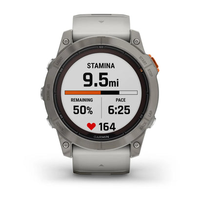 Garmin Fenix 7X Pro Sapphire Solar Edition smartwatch displaying stamina, distance of 9.5 miles, remaining stamina at 50%, pace of 6:25, and heart rate of 164.
