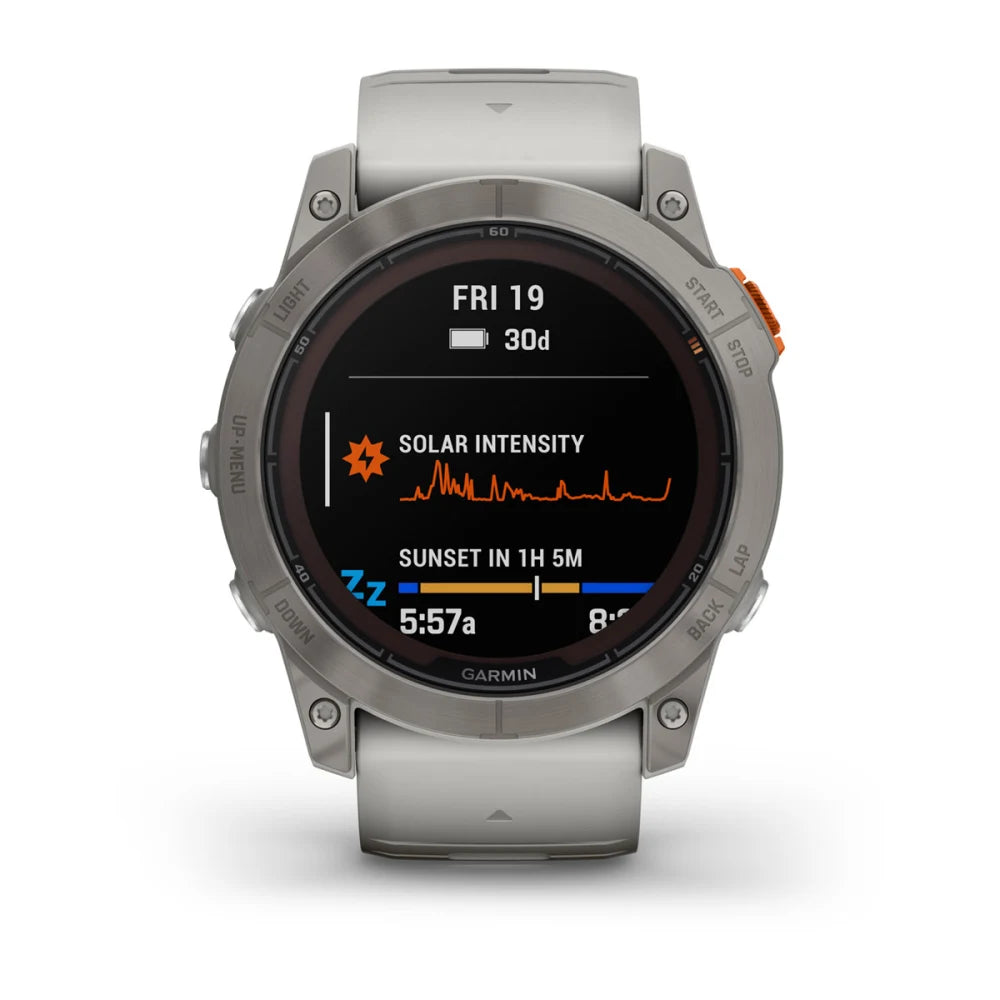 Garmin Fenix 7X Pro Sapphire Solar Edition smartwatch displaying solar intensity and sunset information on its screen.