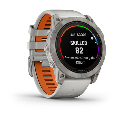 Garmin Fenix 7X Pro Sapphire Solar Edition smartwatch displaying a hill score, skilled level of 82, and a 4-week elevation gain of 4200m on its screen.