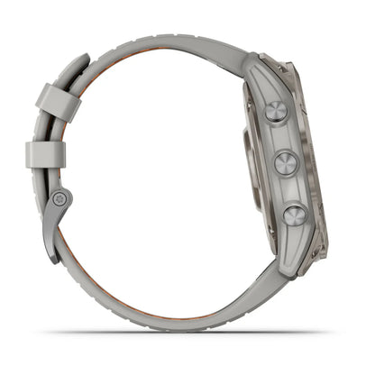 Garmin Fenix 7X Pro Sapphire Solar Edition smartwatch shown from the side, featuring a sleek design and multiple buttons.