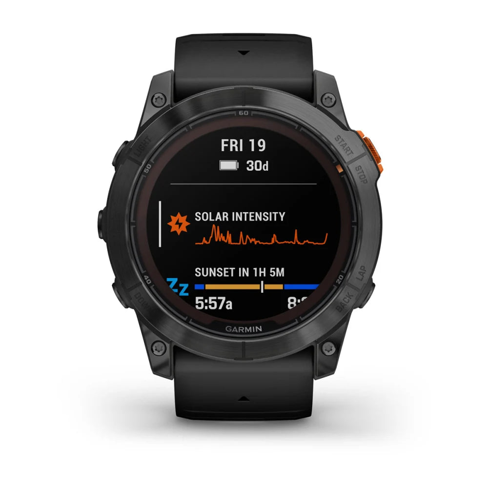 Garmin Fenix 7X Pro Solar Edition smartwatch displaying solar intensity and sunset time on the screen.
